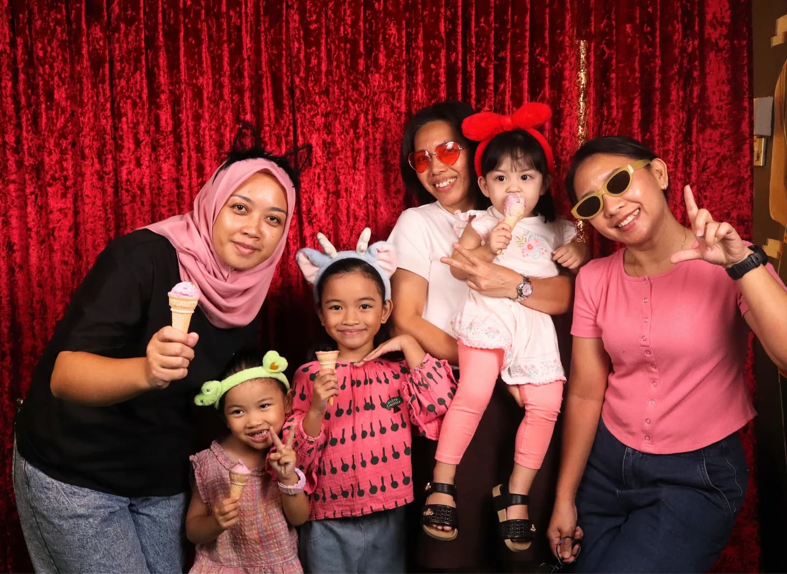Family and friends enjoying Chelsea's birthday photo booth